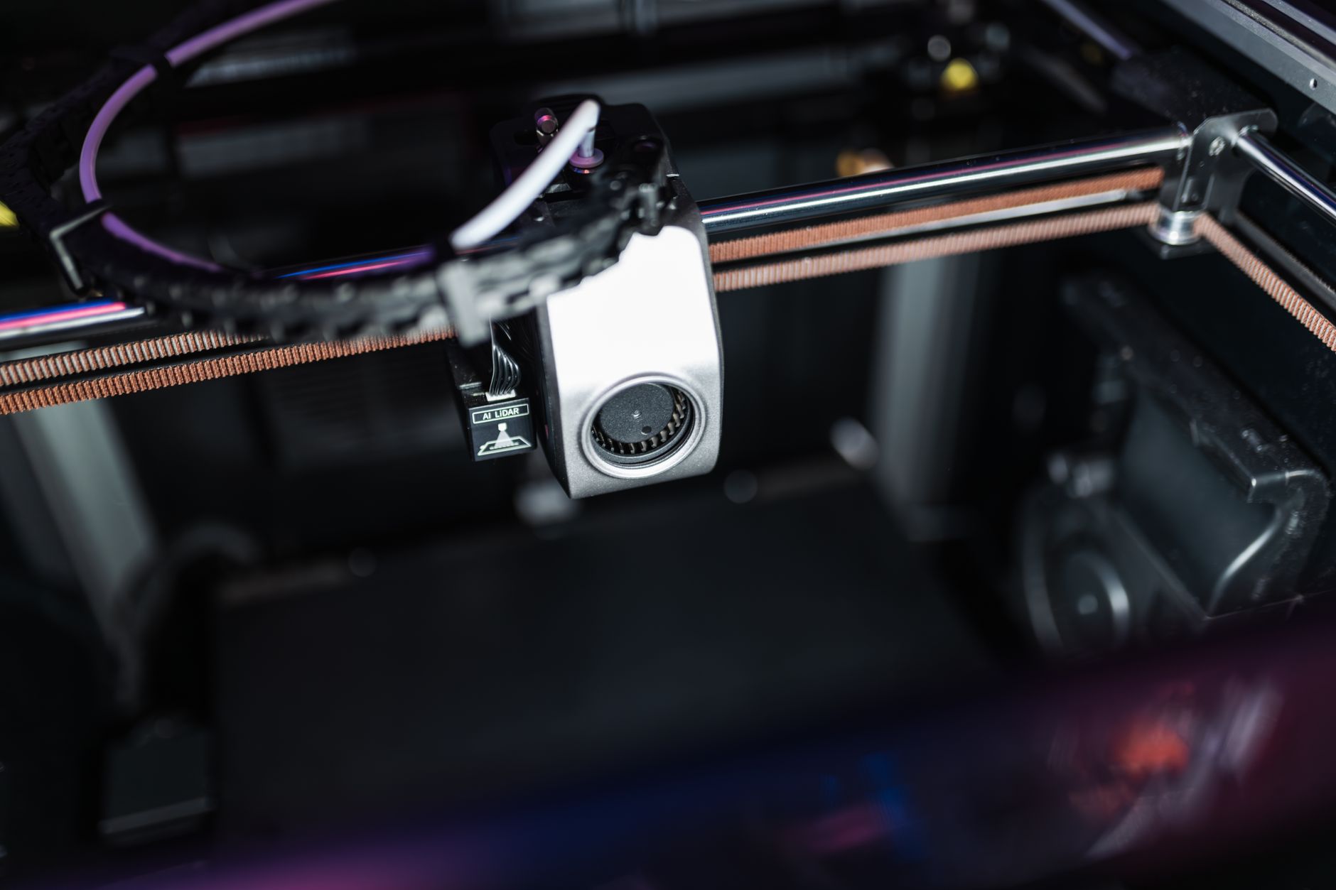 Compact Bambu Lab A1 Mini 3D printer printing a small multicolor object